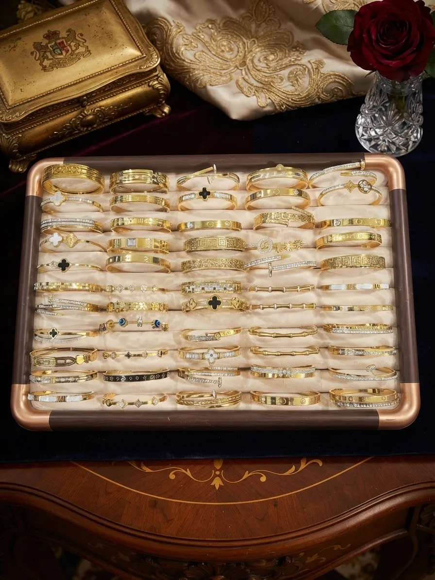 A tray of gold-tone bangles